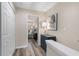 Hallway with a view of a bedroom with a dresser, soft lamp, and decorative print at 2377 Heritage Park Nw Cir # 16, Kennesaw, GA 30144