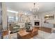 Open living room with fireplace, hardwood floors, and seamlessly connected to the dining area at 2377 Heritage Park Nw Cir # 16, Kennesaw, GA 30144