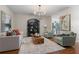 Bright living room featuring hardwood floors, modern decor, and a view to the kitchen at 2377 Heritage Park Nw Cir # 16, Kennesaw, GA 30144