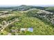 Scenic aerial view of the community featuring lush forests and distant mountains at 3725 Downing Dr, Cumming, GA 30040