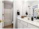 Bright bathroom with tub and shower, white cabinets, and updated fixtures at 3725 Downing Dr, Cumming, GA 30040