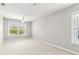 A bright and airy bedroom with neutral carpet and large windows at 3725 Downing Dr, Cumming, GA 30040