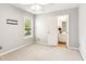 Bright bedroom with a ceiling fan, double door closet, and large window at 3725 Downing Dr, Cumming, GA 30040