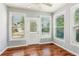 Bright breakfast nook area with sun-drenched windows, and access to the backyard at 3725 Downing Dr, Cumming, GA 30040
