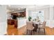 Cozy dining area features hardwood floors and natural light with open plan at 3725 Downing Dr, Cumming, GA 30040