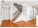 Welcoming foyer with hardwood floors, elegant staircase, and natural light at 3725 Downing Dr, Cumming, GA 30040