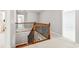 Upstairs hallway with decorative wood and iron railing at 3725 Downing Dr, Cumming, GA 30040