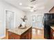 Spacious kitchen with central island and views to backyard at 3725 Downing Dr, Cumming, GA 30040