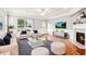 Inviting living room with a fireplace, natural light, and comfortable seating at 3725 Downing Dr, Cumming, GA 30040
