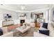 Bright living room features hardwood floors, a cozy fireplace, and neutral paint at 3725 Downing Dr, Cumming, GA 30040