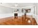 A spacious living room featuring hardwood floors, fireplace and wainscoting at 3725 Downing Dr, Cumming, GA 30040