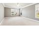 Spacious main bedroom provides ample room, natural light, and comfortable carpet at 3725 Downing Dr, Cumming, GA 30040