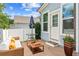 Cozy patio with comfortable seating and an umbrella, perfect for outdoor relaxation at 3725 Downing Dr, Cumming, GA 30040