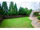 Large, well-maintained backyard featuring lush green grass and mature trees at 4645 Wykeshire Ct, Cumming, GA 30041