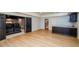 Finished basement with vinyl flooring, a kitchenette, and a movie theatre room at 4645 Wykeshire Ct, Cumming, GA 30041