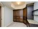 Custom built-in dark wood cabinets with granite countertops in finished basement at 4645 Wykeshire Ct, Cumming, GA 30041