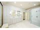 Bright bathroom with double vanity, enclosed glass shower, and large mirrors reflecting the modern interior at 4645 Wykeshire Ct, Cumming, GA 30041