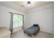 Cozy bedroom with neutral tones, ample natural light, and a comfortable single bed at 4645 Wykeshire Ct, Cumming, GA 30041