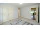 Spacious bedroom with ample closet space, neutral tones, and great light with views into the home at 4645 Wykeshire Ct, Cumming, GA 30041