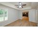 Bedroom with vinyl flooring, fan, and a doorway leading to a movie theater at 4645 Wykeshire Ct, Cumming, GA 30041