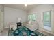 Bedroom with a sofa, stylish rug, balcony, and lots of natural light at 4645 Wykeshire Ct, Cumming, GA 30041