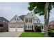 Stately brick home featuring a manicured lawn and a two-car garage at 4645 Wykeshire Ct, Cumming, GA 30041