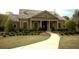 Community clubhouse featuring well-maintained landscaping, neutral paint, walkway, and welcoming entrance at 4645 Wykeshire Ct, Cumming, GA 30041