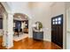 Elegant foyer with hardwood floors and classic trim, with entry to formal dining at 4645 Wykeshire Ct, Cumming, GA 30041