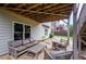 Covered patio featuring comfortable seating, overlooking the landscaped backyard at 4645 Wykeshire Ct, Cumming, GA 30041