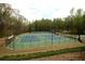 Community tennis courts featuring multiple courts, lighting for evening play, and landscaping at 4645 Wykeshire Ct, Cumming, GA 30041