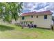 Spacious backyard with patio furniture, grill, and playground at 932 Sugar Meadow Ln, Sugar Hill, GA 30518