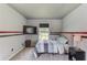 Bedroom with carpet, a flat screen television, and a large window at 932 Sugar Meadow Ln, Sugar Hill, GA 30518