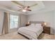 Bright main bedroom with a ceiling fan, and a comfortable king bed at 932 Sugar Meadow Ln, Sugar Hill, GA 30518