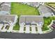 Aerial view of a community with manicured lawns and convenient parking, creating an inviting residential environment at 1181 Chastain Dr, Sugar Hill, GA 30518