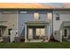 A covered patio extends the living space, creating a cozy area surrounded by privacy screens and greenery at 1181 Chastain Dr, Sugar Hill, GA 30518