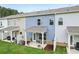 Charming backyard with a covered patio, creating an inviting outdoor living space for residents at 1181 Chastain Dr, Sugar Hill, GA 30518