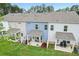 Townhome with a cozy back patio, perfect for relaxation with a small yard and privacy fences at 1181 Chastain Dr, Sugar Hill, GA 30518