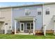 Exterior of home showing back patio, landscaping, and outdoor space at 1181 Chastain Dr, Sugar Hill, GA 30518