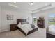 Spacious main bedroom features a tray ceiling, plush carpet, and two windows allowing for natural light at 1181 Chastain Dr, Sugar Hill, GA 30518