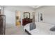Spacious main bedroom features a tray ceiling, plush carpet, and has two entryways into the bathroom at 1181 Chastain Dr, Sugar Hill, GA 30518