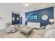 Comfortable living room featuring a modern sofa, plush armchair, and stylish decor at 1181 Chastain Dr, Sugar Hill, GA 30518