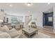 Open-concept living area with a breakfast bar, cozy seating, and modern finishes at 1181 Chastain Dr, Sugar Hill, GA 30518