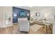 Bright living space showcasing modern decor, comfortable seating, and sleek flooring at 1181 Chastain Dr, Sugar Hill, GA 30518
