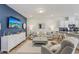 Inviting living room with a stylish sofa, sleek furniture, and open layout to the kitchen at 1181 Chastain Dr, Sugar Hill, GA 30518