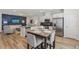 Open floor plan featuring a modern kitchen, a dining area, and a comfy living room at 1181 Chastain Dr, Sugar Hill, GA 30518