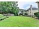 Expansive backyard with manicured lawn and tasteful plantings is perfect for outdoor enjoyment at 1868 Birch Briar Bnd, Lawrenceville, GA 30043