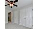 Bedroom with neutral walls, double closets, and view to another room at 1868 Birch Briar Bnd, Lawrenceville, GA 30043