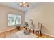Charming bedroom with hardwood floors, a seating area, and natural light, creating a warm and inviting space at 1868 Birch Briar Bnd, Lawrenceville, GA 30043