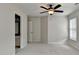 Bedroom with carpet and a ceiling fan, open to the bathroom for convenience and privacy at 1868 Birch Briar Bnd, Lawrenceville, GA 30043