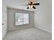 Bedroom with neutral walls, and a large window allowing for lots of natural light at 1868 Birch Briar Bnd, Lawrenceville, GA 30043